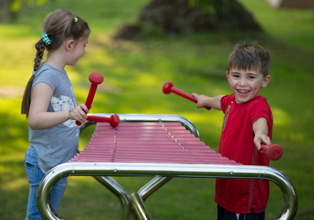 Children Using Outdoor Musical Instruments