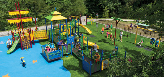 Outdoor Playground Featuring Artificial Turf and Poured in Place Rubber Flooring