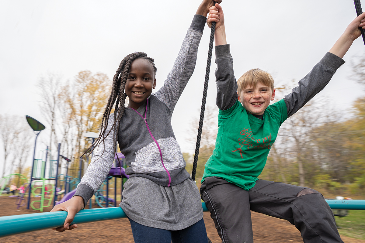 Children Playing on Playground Equipment